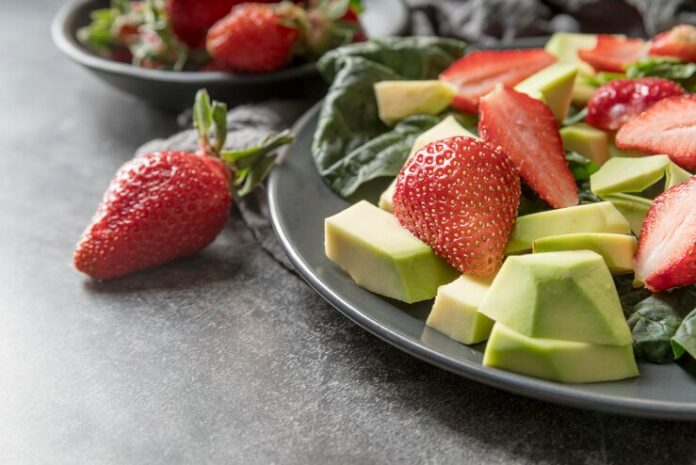 close-up-fresh-salad-with-strawberries_23-2148538641