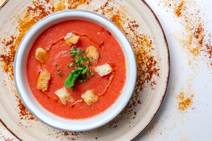 homemade-tomato-soup-with-bread-mint-olive-oil_58460-6125